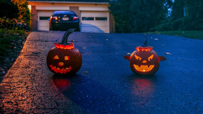 OAKWOOD, OHIO, UNITED STATES – 2020/10/31: Two jack-o-lanterns glow on a driveway as the sun sets during Oakwood’s first “COVID-19 Halloween”.
Normally, Volusia anticipates hundreds of trick-or-treaters but during the first “COVID-19 Halloween” in America, parents played it safe, families wore masks with their costumes and parents ensured that their children did not take off their masks or get too close to those they did not know due to coronavirus fears. Many opted out of the festivities altogether, but those who ventured out were met with buckets full of candy and kind-hearted but distanced waves from neighbors. (Photo by Whitney Saleski/SOPA Images/LightRocket via Getty Images)