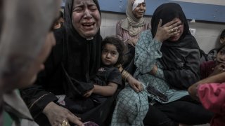 Injured Palestinians taken to Al-Shifa Hospital after an Israeli airstrike on Al-Ahli Baptist Hospital in Gaza City on Oct. 17, 2023.