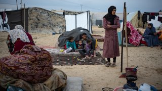 Palestinians displaced by the Israeli ground offensive on the Gaza Strip arrive in the Muwasi area Thursday, Dec. 7, 2023.