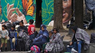 Migrants camp outside the Church of Santa Cruz y La Soledad in Mexico City