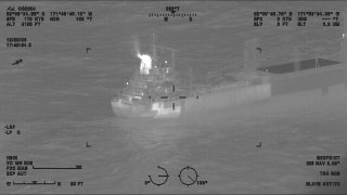 This image provided by the U.S. Coast Guard shows a reported fire aboard the 410-foot cargo vessel