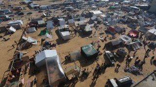 Palestinians displaced by the Israeli bombardment of the Gaza Strip set up a tent camp in Rafah on Dec. 6, 2023.