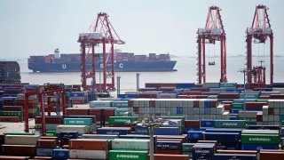 Containers sit at the Yangshan Port in Shanghai, China, Aug. 6, 2019.
