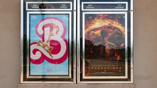 Movie posters for “Barbie” and “Oppenheimer” are pictured outside the Cinemark Somerdale 16 and XD in Somerdale, New Jersey, in 2023.