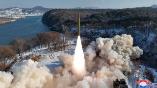 This photo provided by the North Korean government, shows what it says a flight test of a new solid-fuel intermediate-range missile