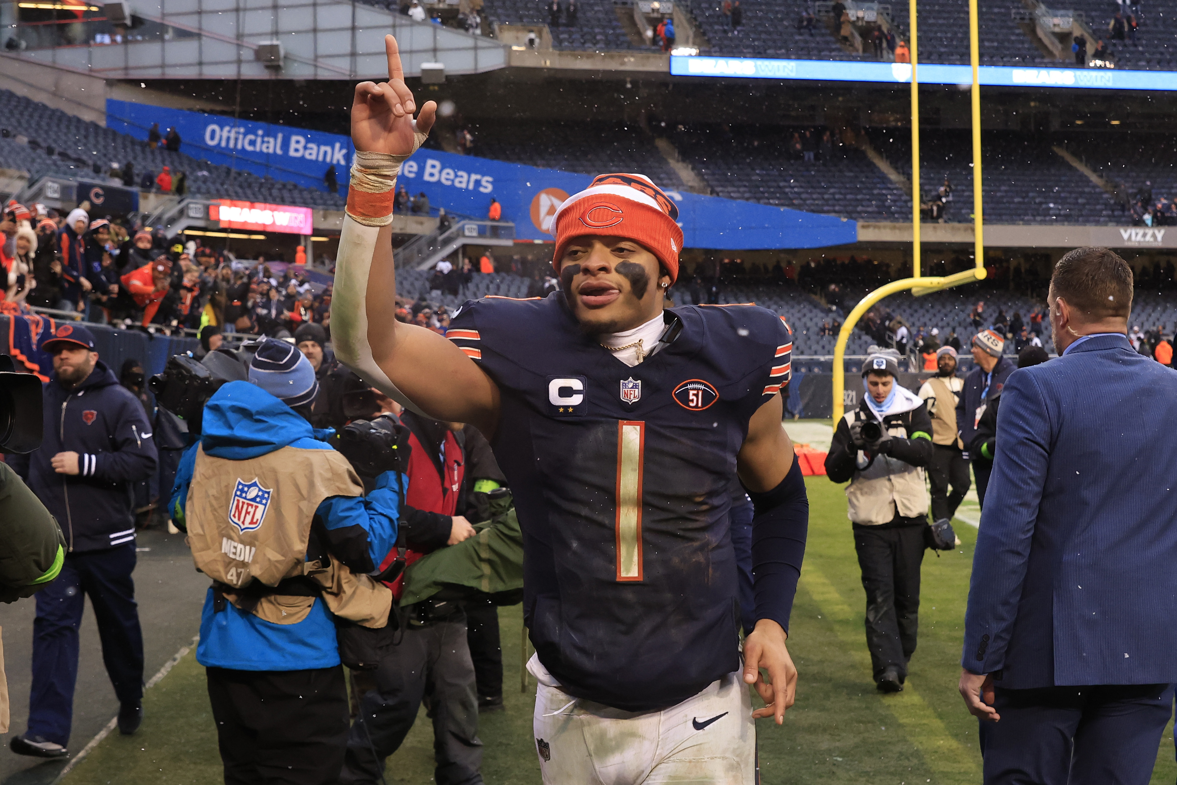 CHICAGO, ILLINOIS – DECEMBER 31: Justin Fields #1 of the Chicago Bears walks off the field after a win over the Atlanta Falcons at Soldier Field on December 31, 2023 in Chicago, Illinois. (Photo by Justin Casterline/Getty Images)