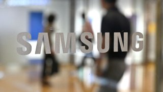 Samsung logo displayed on a glass door at the company’s Seocho building in Seoul on July 7, 2022. Samsung Electronics has begun applications for tax breaks for 11 potential chip plants in Texas adding up to investments of about $192 billion, according to documents filed with Texas authorities.