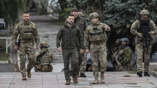 Ukrainian President Volodymyr Zelenskyy attends flag hoisting ceremony in Izium after the Ukrainian forces took control of the city from the Russian forces in Kharkiv, Ukraine on September 14, 2022.  Commander of the Ukrainian Land Forces Oleksandr Syrskyi, Head of the Presidential Office Andriy Yermak, Governor of the Military Administration of the Kharkiv Region Oleg Sinegubov also attended the ceremony.