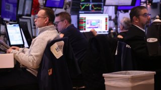 Traders work on the floor of the New York Stock Exchange during afternoon trading on February 05, 2024 in New York City.