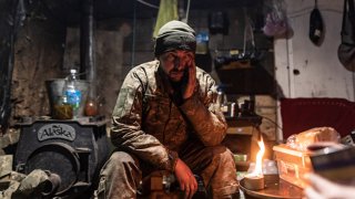 A Ukrainian soldier in a shelter at his fighting position in the direction of Bakhmut, Donetsk Oblast, Ukraine, 20 February 2024.