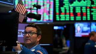 A trader works during the closing bell at the New York Stock Exchange (NYSE) on March 17, 2020 at Wall Street in New York City.