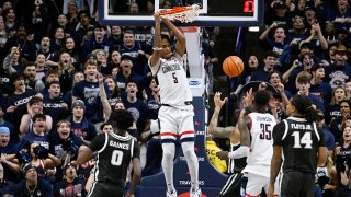 UConn guard Stephon Castle (5) dunks the ball in the first half of an NCAA college basketball game against Providence.