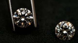 A lab grown diamond, left, and a natural diamond are displayed at Bario Neal, a jewelry store, in Philadelphia, Wednesday, Feb. 7, 2024. Diamonds, whether lab-grown or natural, are chemically identical and entirely made out of carbon.