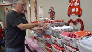 A volunteer sorts Valentine's Day cards in Loveland, Colo.