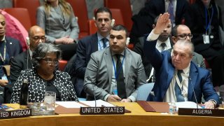 Algerian Ambassador to the United Nations Amar Bendjama, right, votes to approve a resolution concerning a ceasefire in Gaza while Linda Thomas-Greenfield, United States Ambassador to the U.N., left, looks on during a Security Council meeting at United Nations headquarters, Tuesday, Feb. 20, 2024.