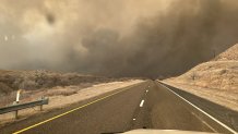 TEXAS, UNITED STATES - FEBRUARY 28: Smoke rises on the roadway in Hutchinson County after the Juliet Pass fire broke out in Armstrong County, Texas, United States on February 28, 2024. 