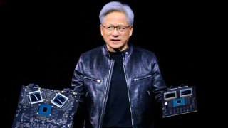 NVIDIA’s founder and CEO Jensen Huang displays products on-stage during the annual Nvidia GTC Artificial Intelligence Conference at SAP Center in San Jose, California, on March 18, 2024. 