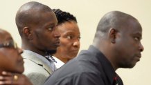 FILE - Michael Corey Jenkins, center, and Eddie Terrell Parker, right, listen as one of six former Mississippi law officers pleads guilty to state charges at the Rankin County Circuit Court in Brandon, Miss., Aug. 14, 2023.