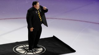 TD Garden bartender Todd Angilly sings the national anthem before Game 1 of the 2019 Stanley Cup Finals between the Boston Bruins and the St. Louis Blues at TD Garden in Boston on May 27, 2019.