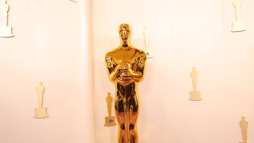 A view of a large Oscar statue on the red carpet during the set-up of the 96th Academy Awards