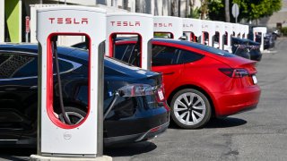 Drivers charge their Teslas in Fountain Valley, CA, on Wednesday, March 20, 2024.