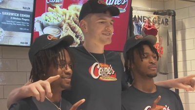 UConn men's basketball stars serve fans Raising Cane's chicken