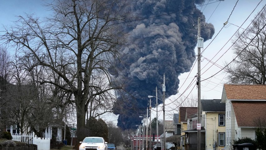 A black plume rises over East Palestine, Ohio, as a result of a controlled detonation of a portion of the derailed Norfolk Southern trains Monday, Feb. 6, 2023.