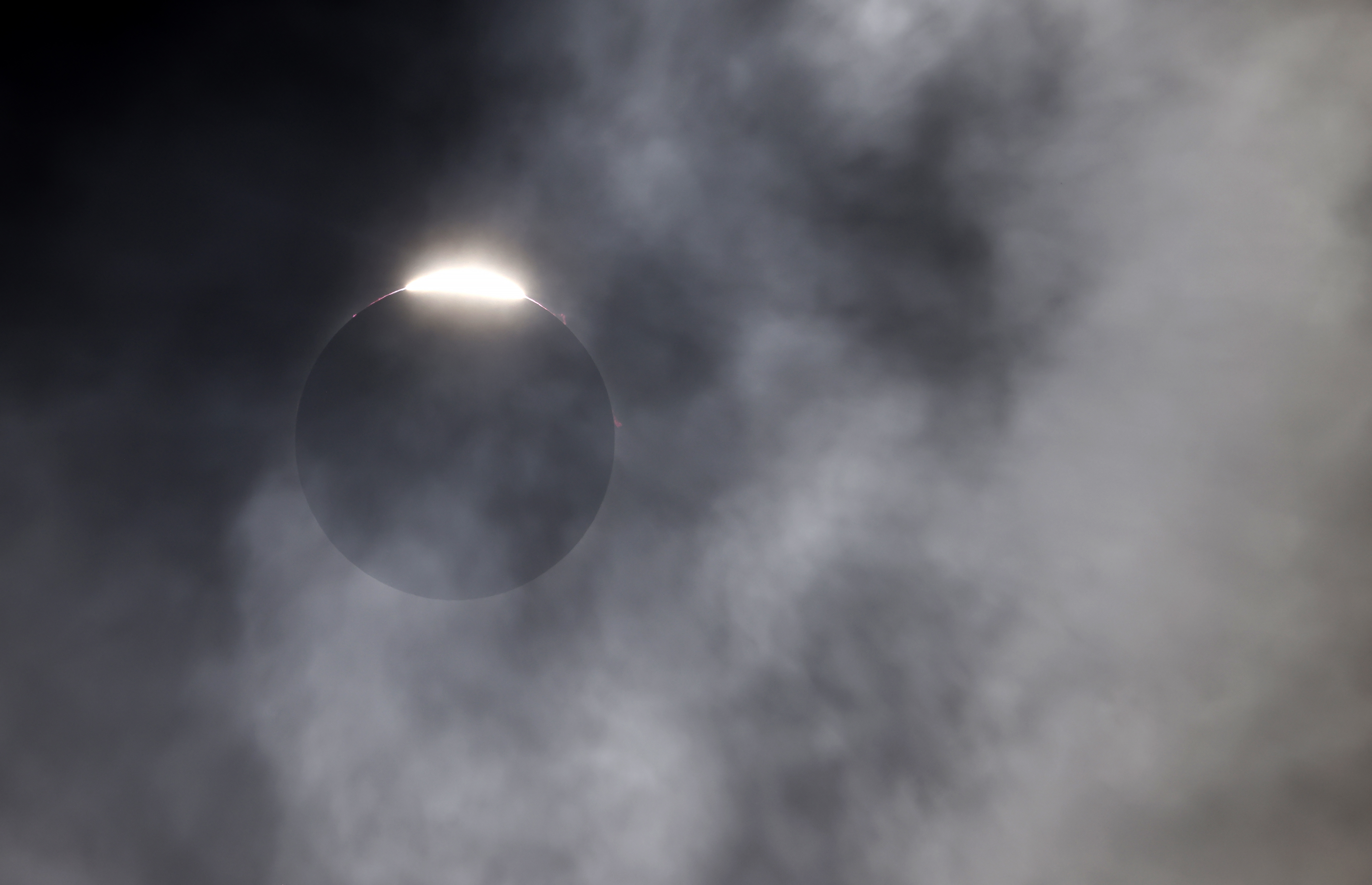 The diamond ring effect is seen as the moon eclipses the sun on April 8, 2024 in Fort Worth, Texas.