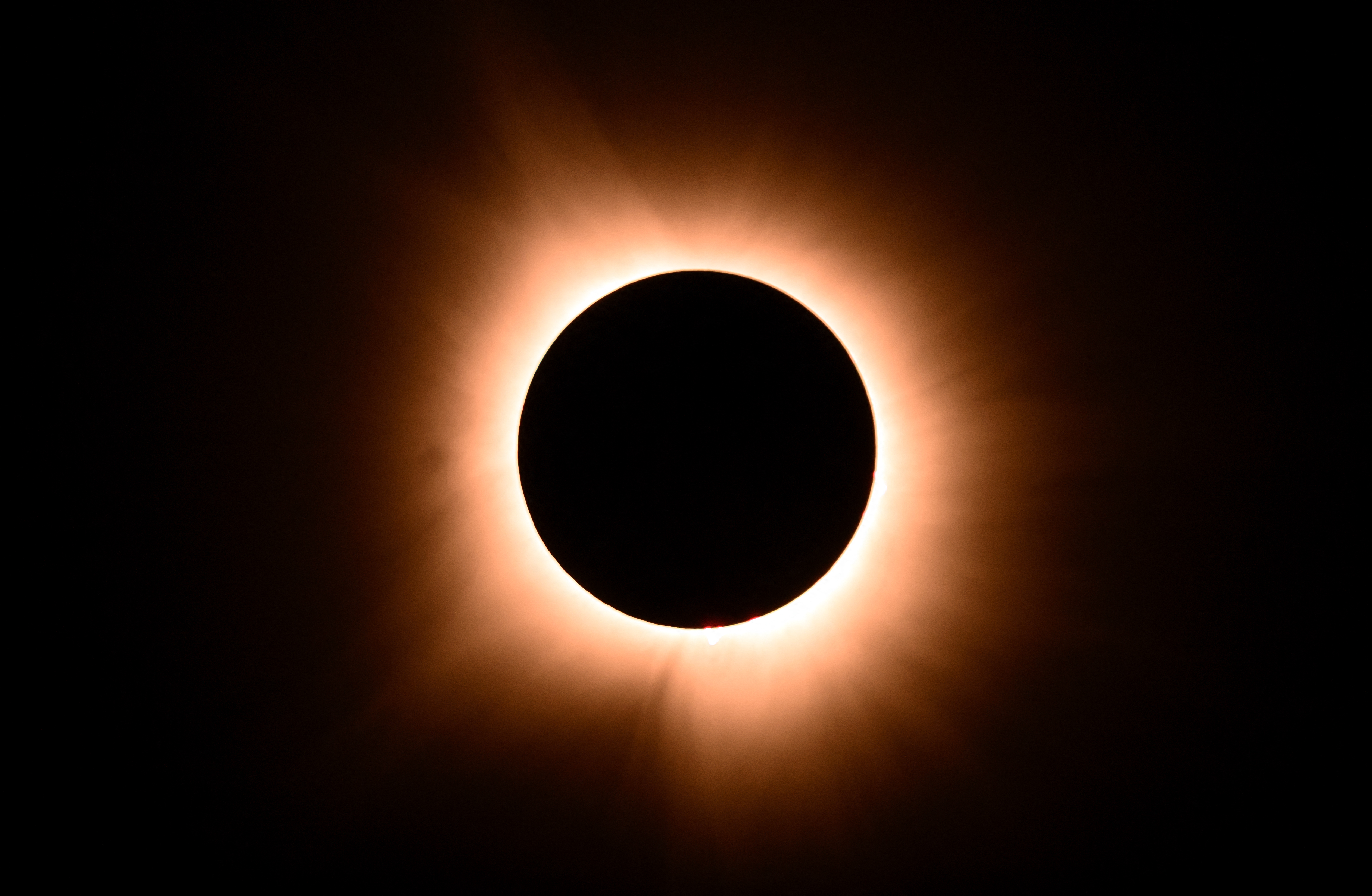 The moon eclipses the sun during a total solar eclipse across North America, in Bloomington, Indiana, on April 8, 2024. This year’s path of totality is 115 miles (185 kilometers) wide and home to nearly 32 million Americans, with an additional 150 million living less than 200 miles from the strip. The next total solar eclipse that can be seen from a large part of North America won’t come around until 2044.