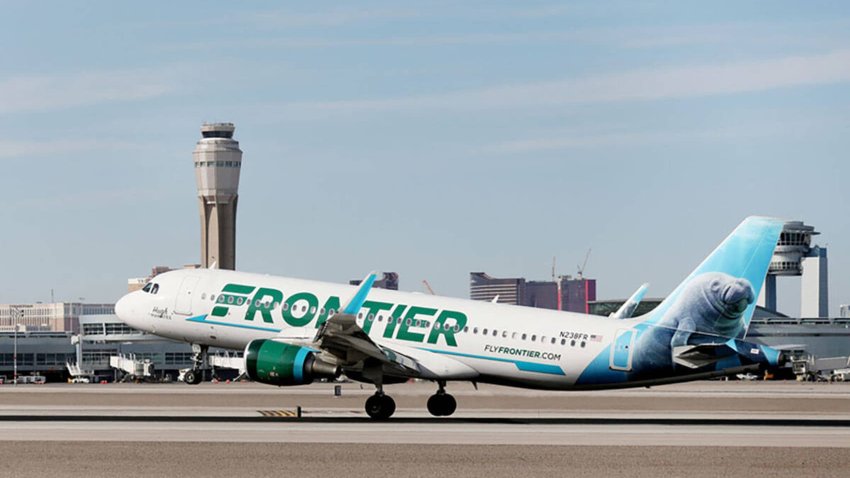 A Frontier Airlines plane lands at the McCarran International Airport in Las Vegas on Feb. 27, 2020.