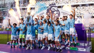 Kyle Walker of Manchester City lifts the Premier league trophy