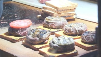 People celebrate National Hamburger Day at New Haven's Louis' Lunch