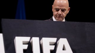 FIFA President Gianni Infantino walks on the stage before the start of the 69th FIFA congress in Paris.