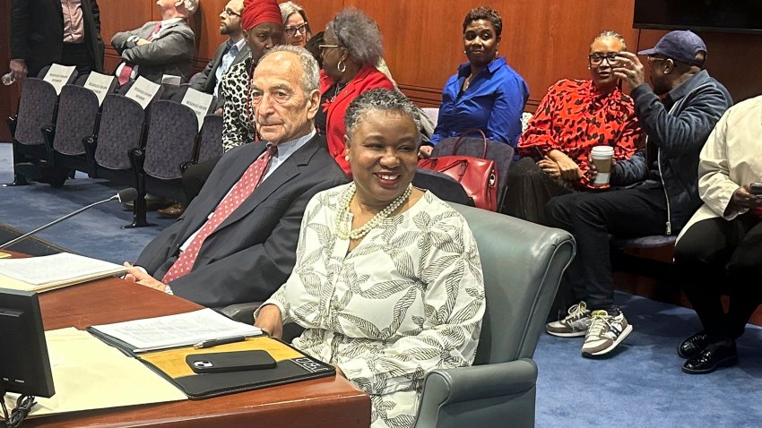 FILE – Connecticut Chief Public Defender Tashun Bowden-Lewis chats with supporters before a hearing at the Legislative Office Building in Hartford, Conn. on April 16, 2024. Bowden-Lewis is facing the possibility of being fired Tuesday, May 21, 2024, when an oversight panel is expected to decide a punishment for what it calls serious misconduct.