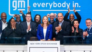 General Motors CEO Mary Barra, center, at the New York Stock Exchange, Nov. 17, 2022.