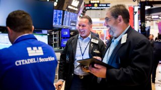 Traders work on the floor of the New York Stock Exchange.
