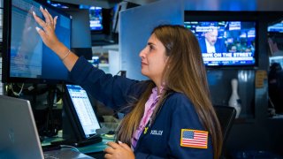 Traders work on the floor of the New York Stock Exchange.