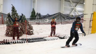 Participants during the snowboarding activity with the Hoods to Woods Foundation at Big Snow American Dream in East Rutherford, New Jersey on June 13, 2024. 