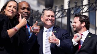 From left, Reps. Monica De La Cruz, R-Texas, Wesley Hunt, R-Texas, Ronny Jackson, R-Texas, and Dan Crenshaw, R-Texas, display Texas temporary tattoos to mark Texas Independence Day, which in on March 2nd, on the house steps of the U.S. Capitol after the last votes of the week on Wednesday, March 1, 2023.