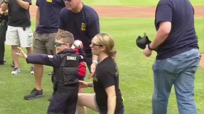 Fallen state trooper's son throws out first pitch at Yard Goats game