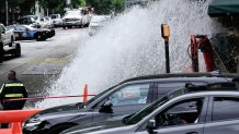 Water gushes out of a broken water transmission line in downtown Atlanta