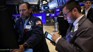 Traders work on the floor of the New York Stock Exchange on June 24, 2024.