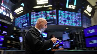 A trader works on the floor at the New York Stock Exchange on July 3, 2024.