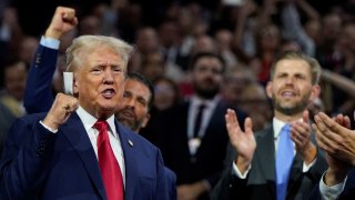 Republican presidential nominee and former U.S. President Donald Trump raises his fist during Day 1 of the Republican National Convention (RNC) at the Fiserv Forum in Milwaukee, Wisconsin, U.S., July 15, 2024. 