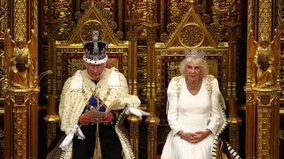 King Charles III, wearing the Imperial State Crown and the Robe of State reads the King’s Speech from the The Sovereign’s Throne next to Queen Camilla, wearing the George IV State Diadem in the House of Lords chamber, in the Houses of Parliament on July 17, 2024 in London, England.