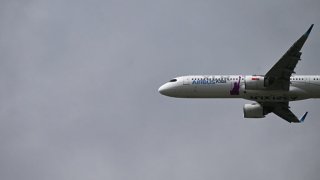 An Airbus A321-XLR takes part in an air display on the opening day of the Farnborough International Airshow 2024, south west of London, on July 22, 2024. 