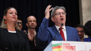 Far-left La France Insoumise - LFI - (France Unbowed) founder Jean-Luc Melenchon delivers a speech at the party election night headquarters, Sunday, July 7, 2024 in Paris. A coalition on the left that came together unexpectedly ahead of France's snap elections won the most parliamentary seats in the vote, according to polling projections Sunday. The surprise projections put President Emmanuel Macron's centrist alliance in second and the far right in third. At left is LFI's Mathilde Pant and at center Manuel Bompard.