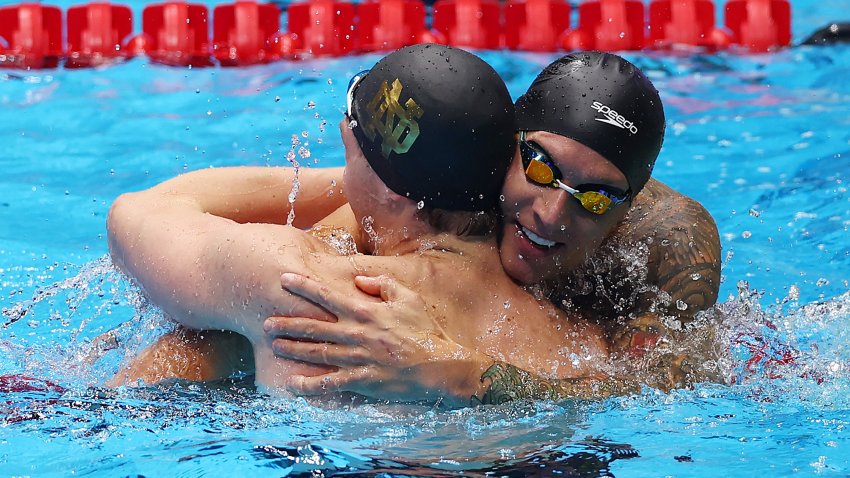 Chris Guiliano and Caeleb Dressel hug after the Men’s 50m freestyle final at the 2024 U.S. Olympic Team Swimming Trials.