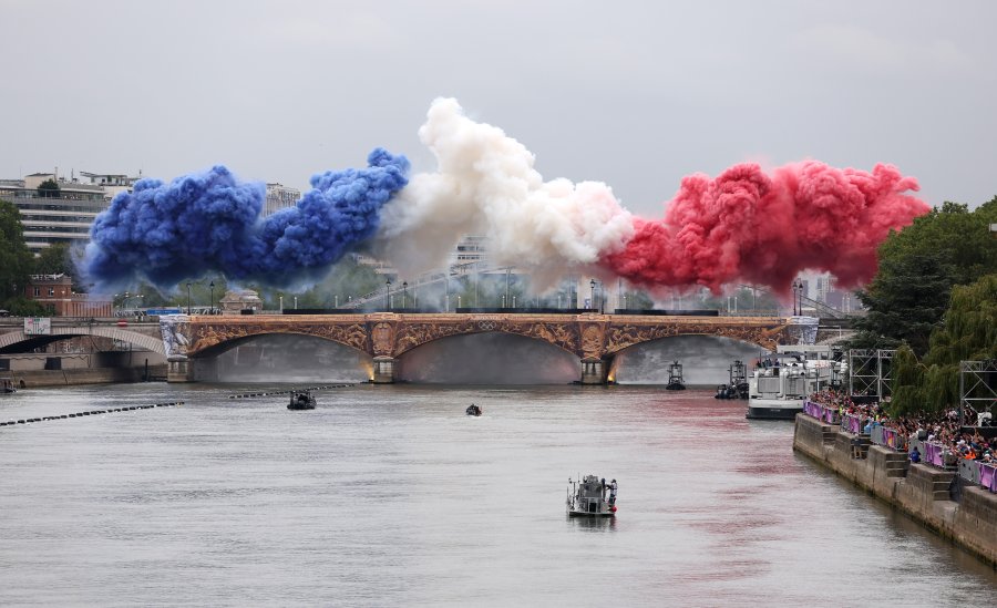 Smoke resembling the flag of Team France is shown