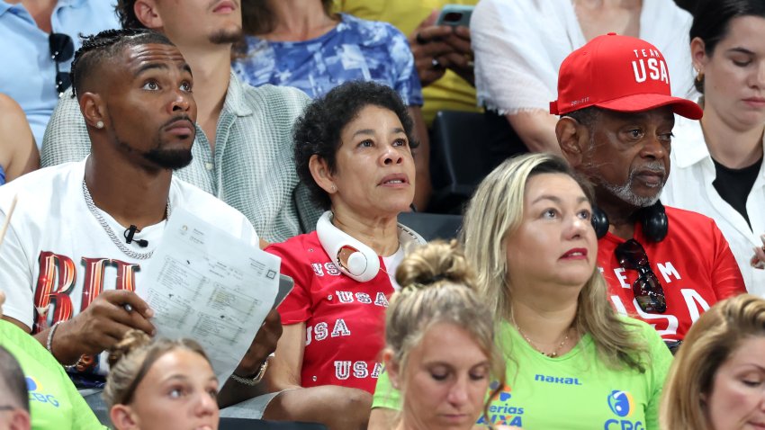 PARIS, FRANCE – JULY 30: Family members of Simone Biles of Team United States, (L-R) her husband Jonathan Owens and parents Nellie and Ronald Biles look on during the Artistic Gymnastics Women’s Team Final on day four of the Olympic Games Paris 2024 at Bercy Arena on July 30, 2024 in Paris, France. (Photo by Pascal Le Segretain/Getty Images)